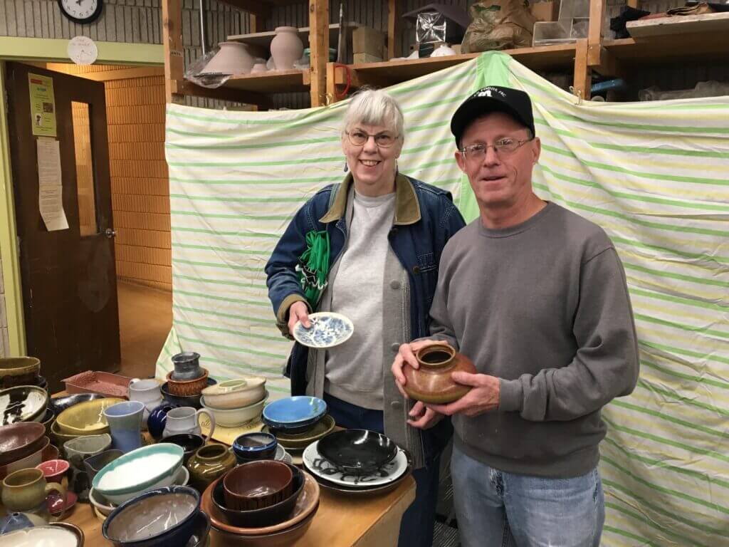 2 Volunteers With Pottery at CSK