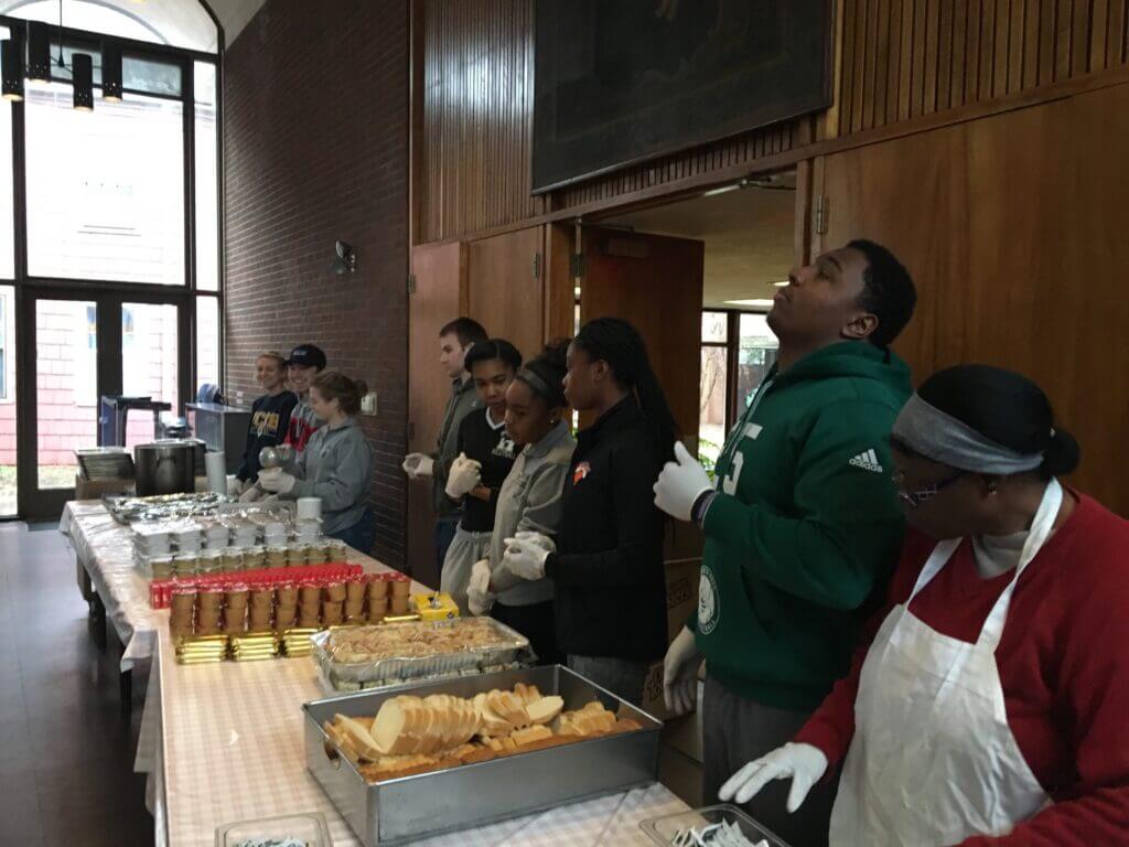Serving a meal at Community Soup Kitchen New Haven